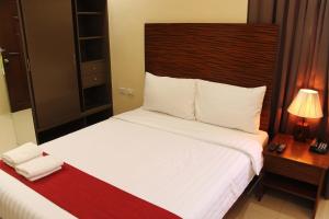 Uma cama ou camas num quarto em Sebastien Hotel
