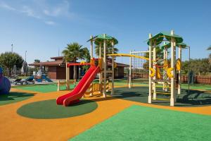 a playground with a red slide and a slideintend at Vila Gale Lagos in Lagos
