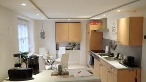 a kitchen with a sink and a counter top at Ferienwohnung in Naila in Naila +18 photos