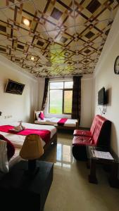 a room with two beds and a couch in it at Northview Hotel Hunza in Hunza Valley +25 photos
