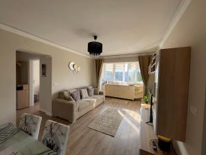 a living room with a couch and a table at Victoria City View in Victoria