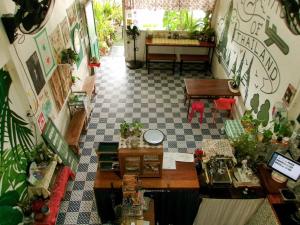 an overhead view of a room with plants on the walls at 11:11 Hostel in Phra Nakhon Si Ayutthaya