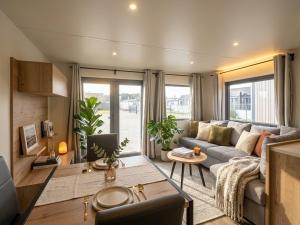 a living room with a couch and a table at Beachside Vakantiepark in Blankenberge