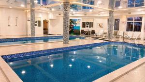 a large swimming pool in a hotel room at HotelVizit in Solotvyno