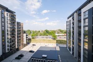 an aerial view of a parking lot between two buildings at River View 1-Bedroom Apartment in Plovdiv