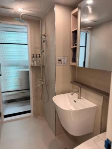 a bathroom with a sink and a shower at TRAVELUS Myeongdong 트래블어스 명동 in Seoul +63 photos