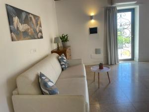 a living room with a couch and a table at Corte Impero Hotel & Restaurant in Affi +64 photos