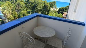 a table and chairs on a balcony with a view at Il respiro del mare in Montesilvano