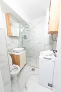 a bathroom with a toilet and a sink at Apartman Gorica in Priboj