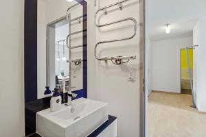 a bathroom with a sink and a mirror at Triangel B Rezia in Parpan +23 photos