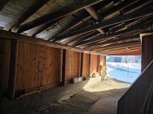 an inside view of a building with wooden walls at Maiensäss Crapera in Lenzerheide