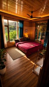 a bedroom with a bed and a large window at Ghar Homestay in Kulu +18 photos
