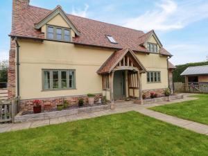a detached house with a pitched roof at Gayton Stables in Wirral