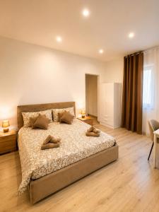 a bedroom with a bed with two pillows on it at Tenuta Saracena in Ostuni +39 photos