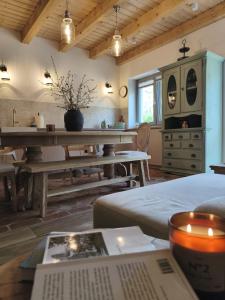 a living room with a couch and a table at Dublinkowo in Gołubie