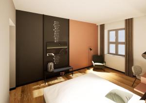 a bedroom with a bed and a black wall at Essential by Dorint Mannheim Taylor Park in Mannheim