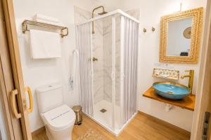 a bathroom with a shower and a toilet and a sink at Hostal playa Dreams náutico Adults in Garrucha