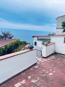 a view of the ocean from the balcony of a house at Villa Iovane Diamond in Ustica