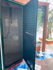 a shower with a glass door in a bathroom at Villa Iovane Diamond in Ustica +2 photos