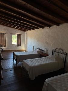 a bedroom with two beds and a window at Dulce Claudina 3 in Mercedes