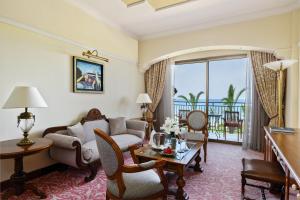 a living room with a couch and a table at Elysium in Paphos
