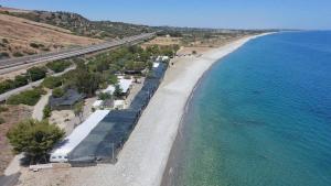 an aerial view of a beach next to the ocean at Campeggio Il Delfino in Rocca Imperiale +6 photos
