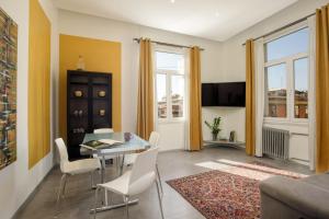 a living room with a table and chairs at Rooftop St. Peter in Rome