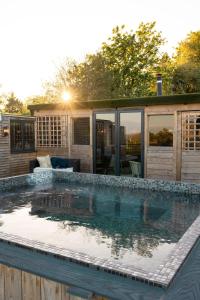 a swimming pool in front of a house at The Durham Ox in Crayke