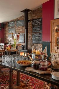 a restaurant with a buffet of food on a table at The Durham Ox in Crayke
