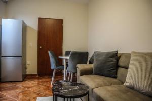 a living room with a couch and a table at D&N Adriatic Nest in Kotor