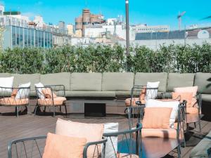a group of chairs and a table and a couch at Room Lisboa in Lisbon