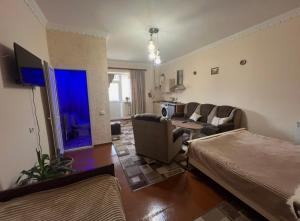 a living room with a couch and a table at Norik guest house in Garni