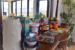 a wooden table with food on top of it at Benview House in Staffin +10 photos