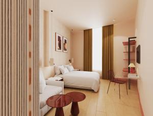 a hotel room with a bed and a couch at BYPILLOW Naranjo in Seville
