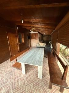 a large wooden table in the middle of a room at Campeggio Il Delfino in Rocca Imperiale