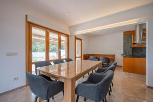 a conference room with a wooden table and chairs at Luxury Getaway in Girona in Riudellots de la Selva
