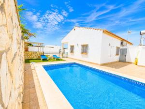a villa with a swimming pool and a house at Chalet Playa Roche in Roche +12 photos