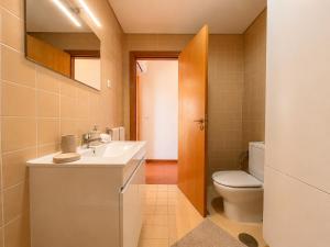 a bathroom with a sink and a toilet at Aqua Gerês in Geres