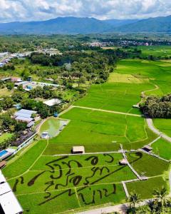 an aerial view of a field with graffiti on it at Sangthong Resort at Chiang Klang in Chiang Klang