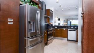 a large kitchen with a stainless steel refrigerator at 122 Mariners Club in Key Largo