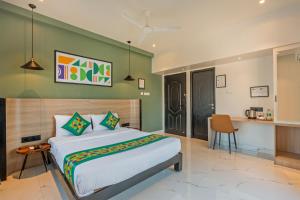 a bedroom with a large bed in a room at Treebo Premium Vapr Ashok Nagar in Chennai