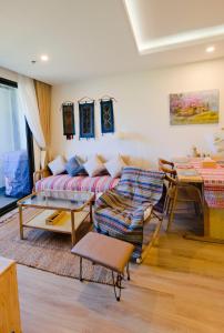 a living room with a couch and a table at Lia Home in Sapa