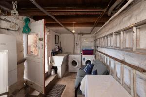 a room with a washing machine and a sink in it at Beresford Cottage in North Berwick +21 photos