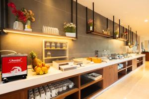 a kitchen with a counter with fruit on it at Grand Continent Hotel, Rameswaram in Rāmeswaram