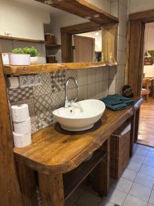 a sink on a wooden counter in a kitchen at Central & Quiet Cēsis Stay in Cēsis