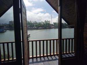 a view of a river from a house balcony at Bliss 10 people in Palayangan