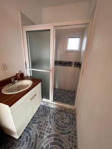 a bathroom with a shower and a sink at Villa Patty by the beach in El Conacaste +60 photos