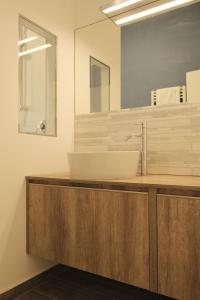 a bathroom with a sink and a mirror at Hotel Mariblu in Rimini +19 photos