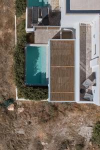 an overhead view of a house with a swimming pool at Paros Cape Suites in Naousa