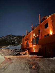 a car parked in front of a building in the snow at Morgondoppet - Olen Funäsdalen in Funäsdalen +27 photos